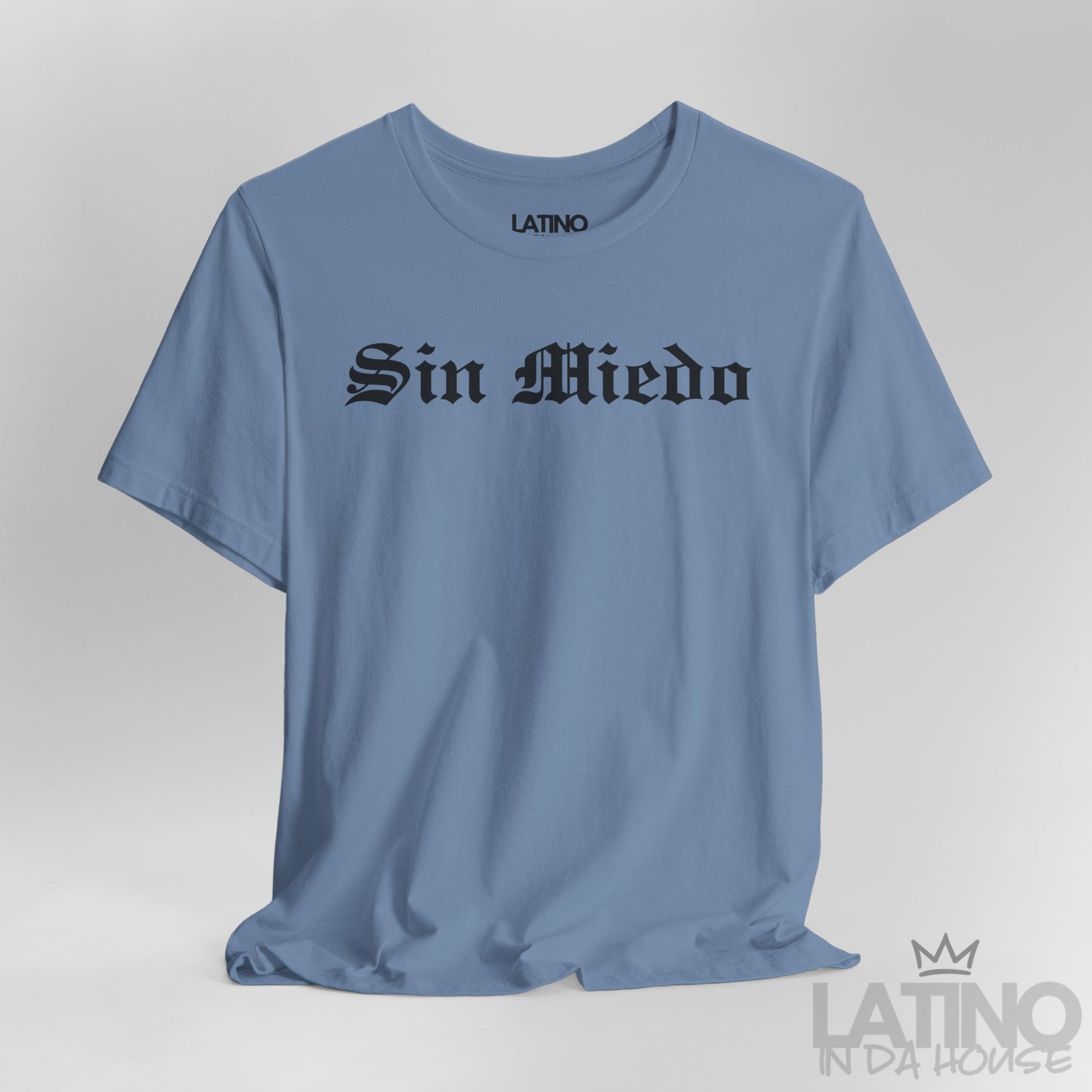 Close-up view of Sin Miedo T-Shirt in steel blue with bold black gothic lettering. Latino In Da House 