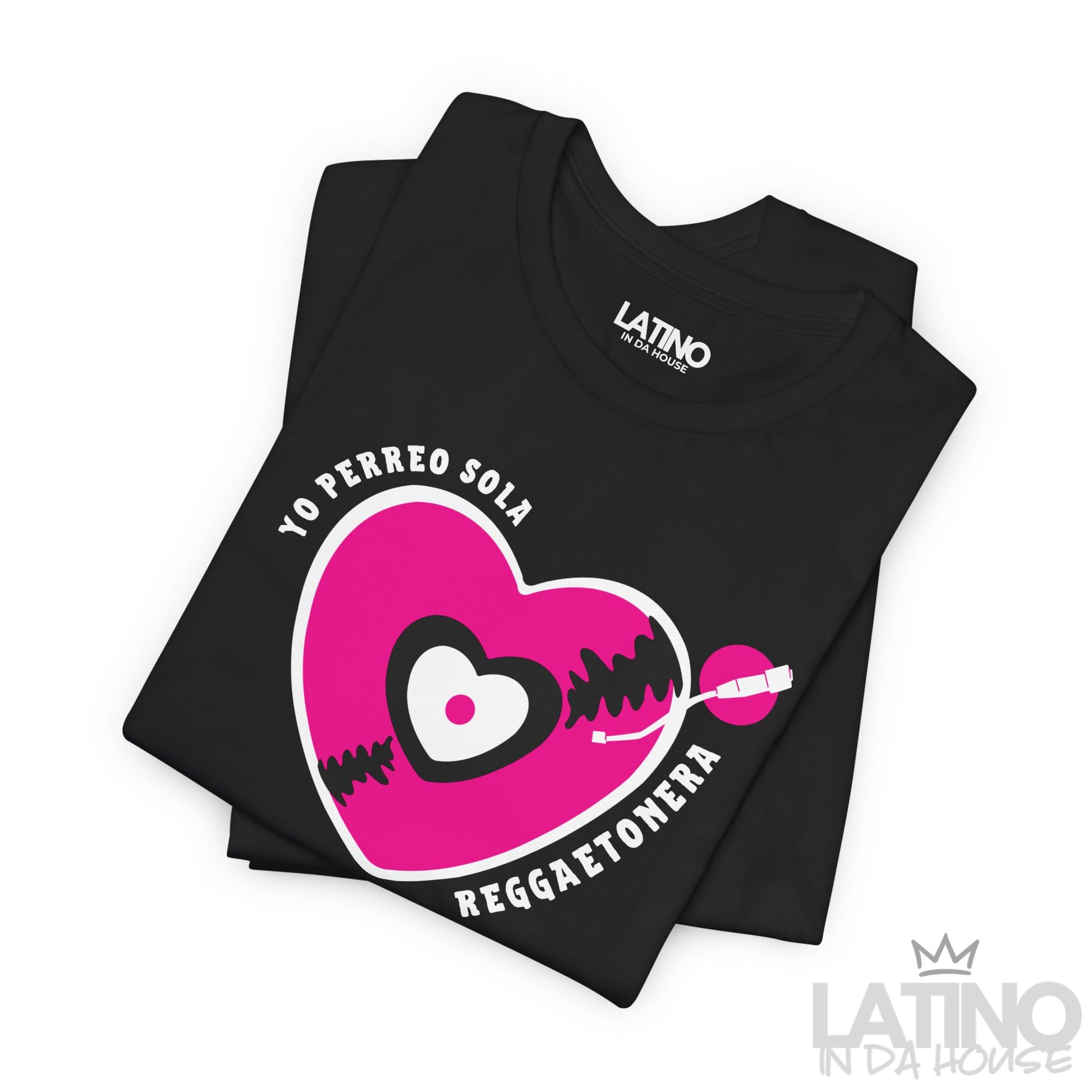 Flatlay of black Yo Perreo Sola Reggaetonera T-shirt with bold reggaeton graphic heart. Latino In Da House 