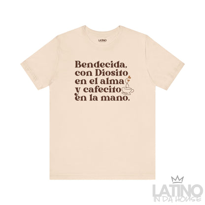Bendecida con Diosito y Cafecito T-Shirt in soft cream with brown text and coffee cup illustration. Latino In Da House 