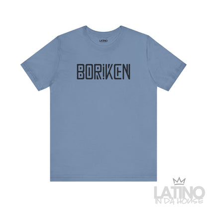 Steel blue Borikén T-shirt featuring bold black block-style lettering with Taíno-inspired details.