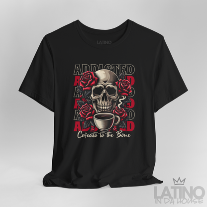 Close Up Black T-shirt with skull, roses, repeated “ADDICTED” backdrop, and script “Cafecito to the Bone. Latino In Da House 