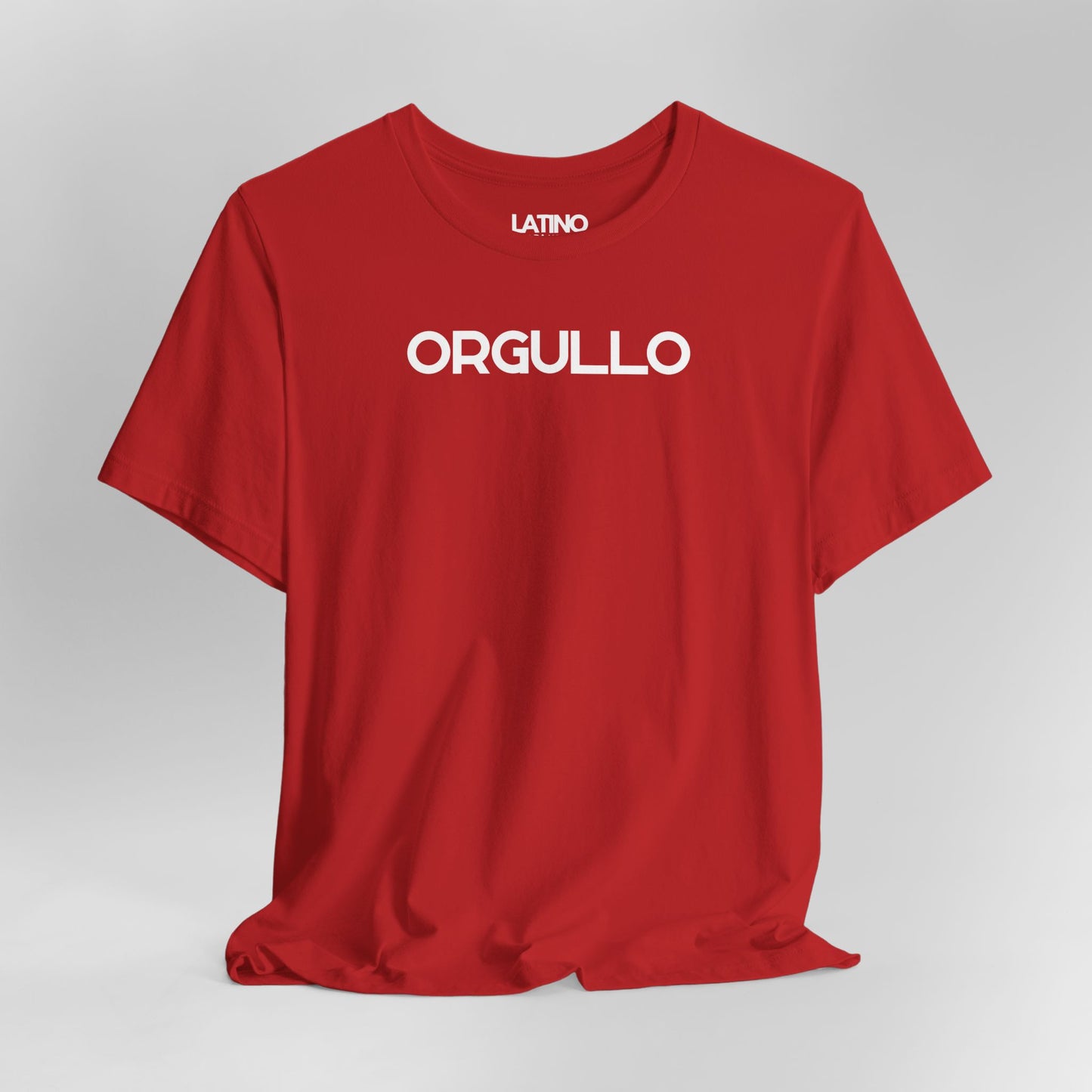 Close up Orgullo t-shirt in red with bold white lettering. Latino In Da House