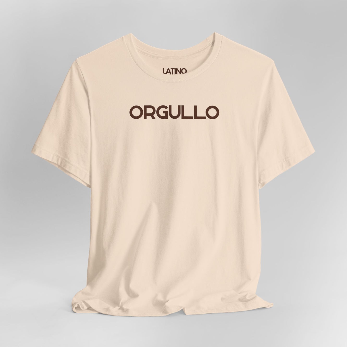 Close up Orgullo t-shirt in soft cream with bold brown lettering. Latino In Da House
