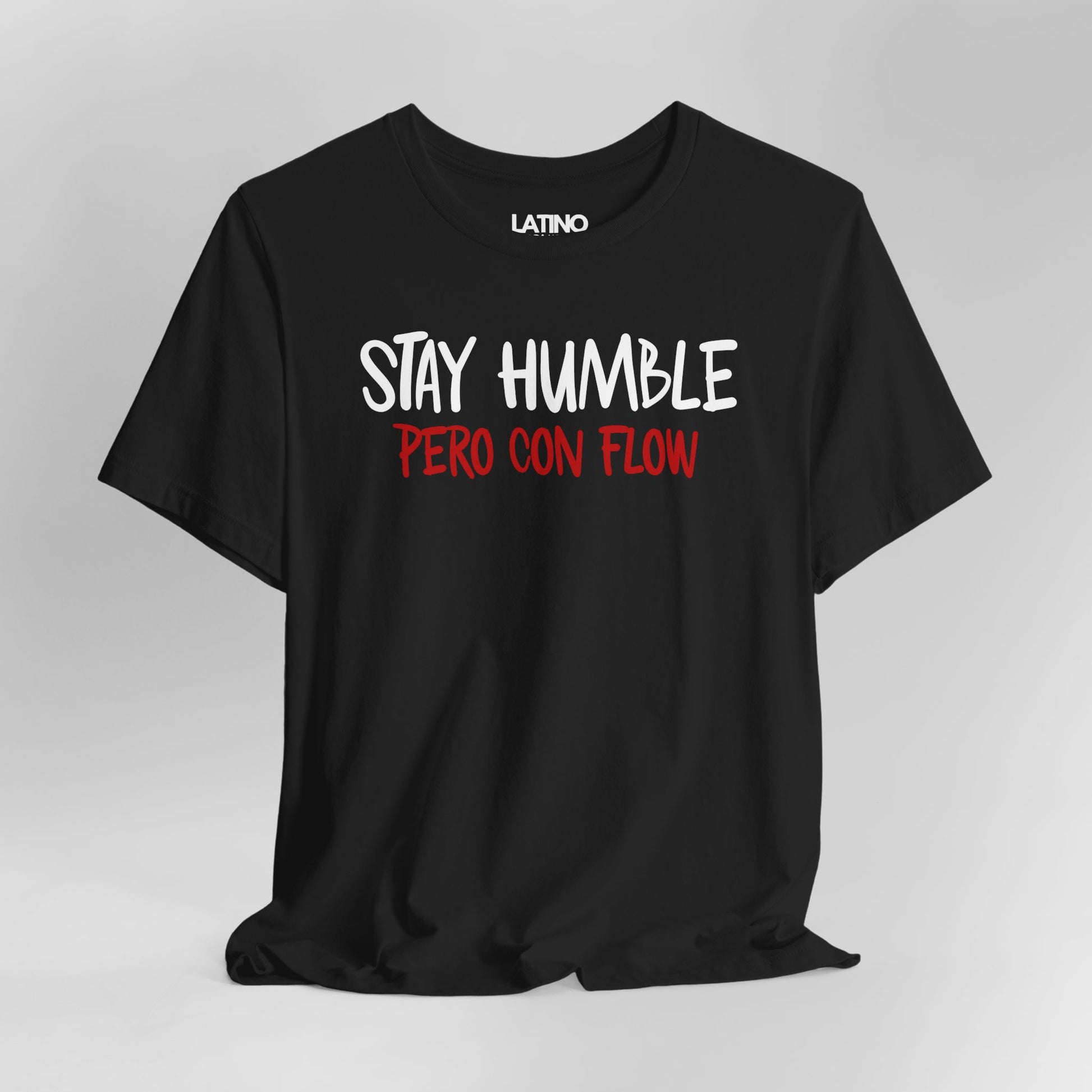 Close Up Black Stay Humble Pero Con Flow T-shirt with white text, minimalist Latino streetwear design promoting humble and flow. Latino In Da House