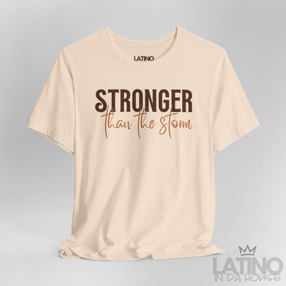 Close Up Stronger Than The Storm tee in soft cream – brown and caramel typography. Latino In Da House 