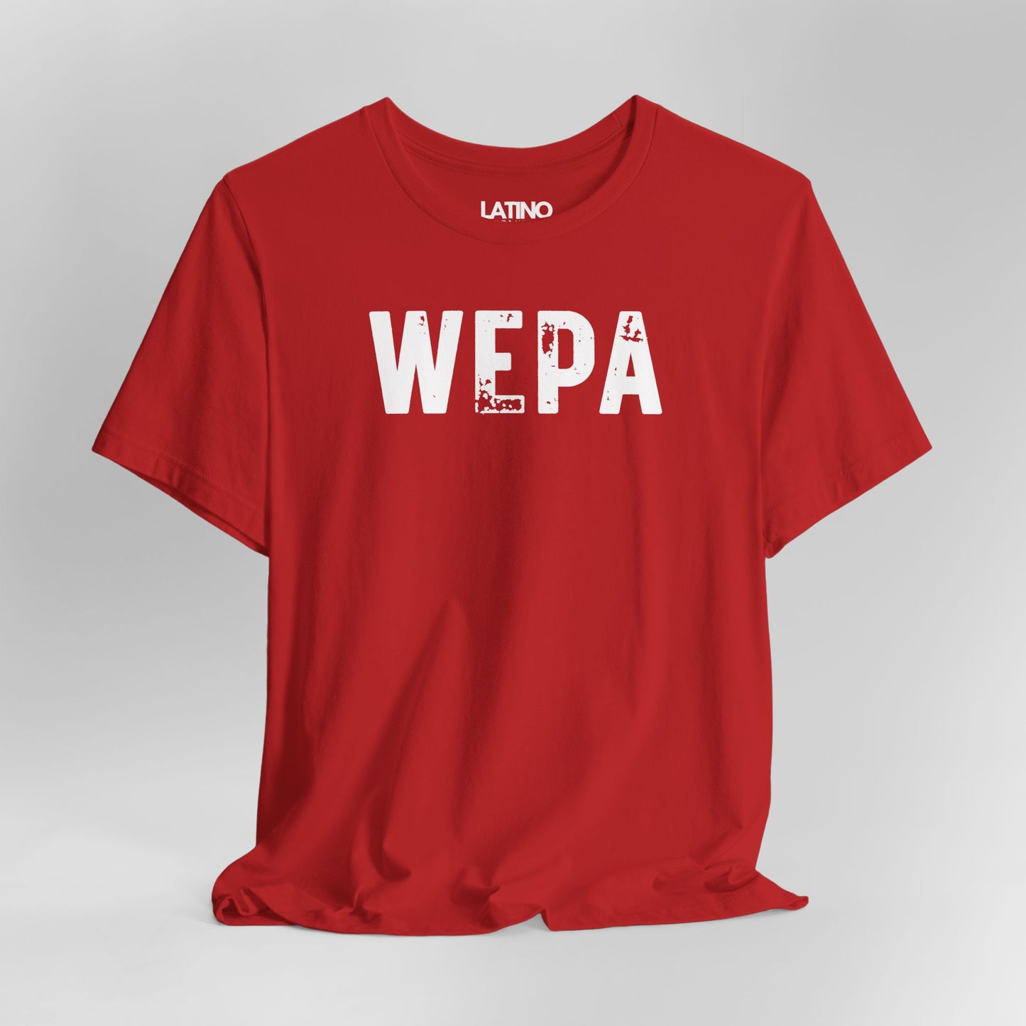 Close Up Red "WEPA" Latino t-shirt with bold white text on clean background - Latino streetwear tee. Latino In Da House