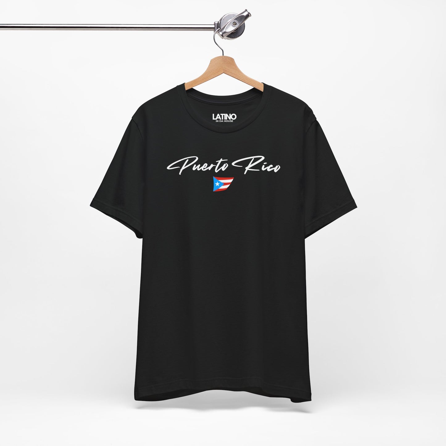 On Hanger Black T-shirt with white Puerto Rico script lettering and small Puerto
Rican flag graphic by Latino In Da House.
