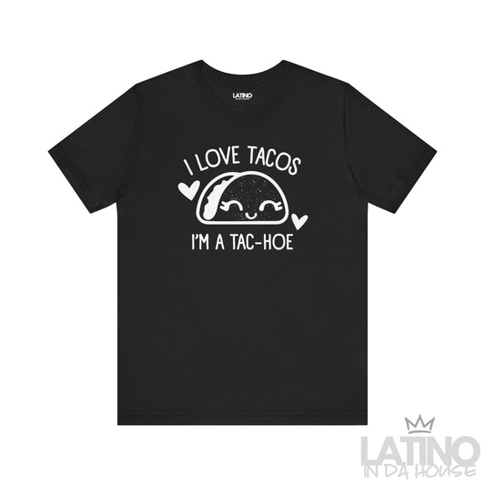 I Love Tacos I’m a Tac-Hoe T-Shirt in black with white print — playful and sassy taco-lover design. Latino In Da House 