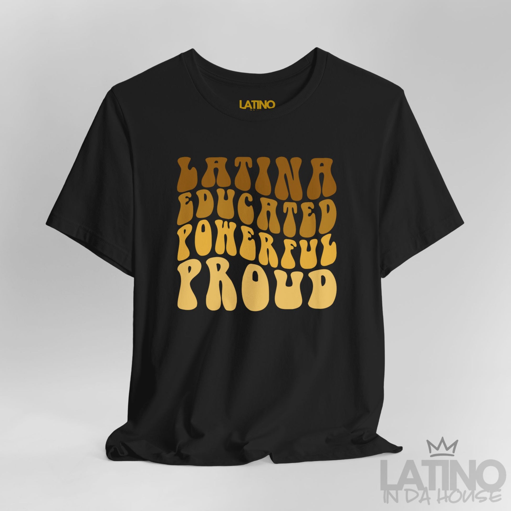 Close-up of golden retro bubble lettering ‘Latina Educated Powerful Proud’ on black tee. Latino In Da House 