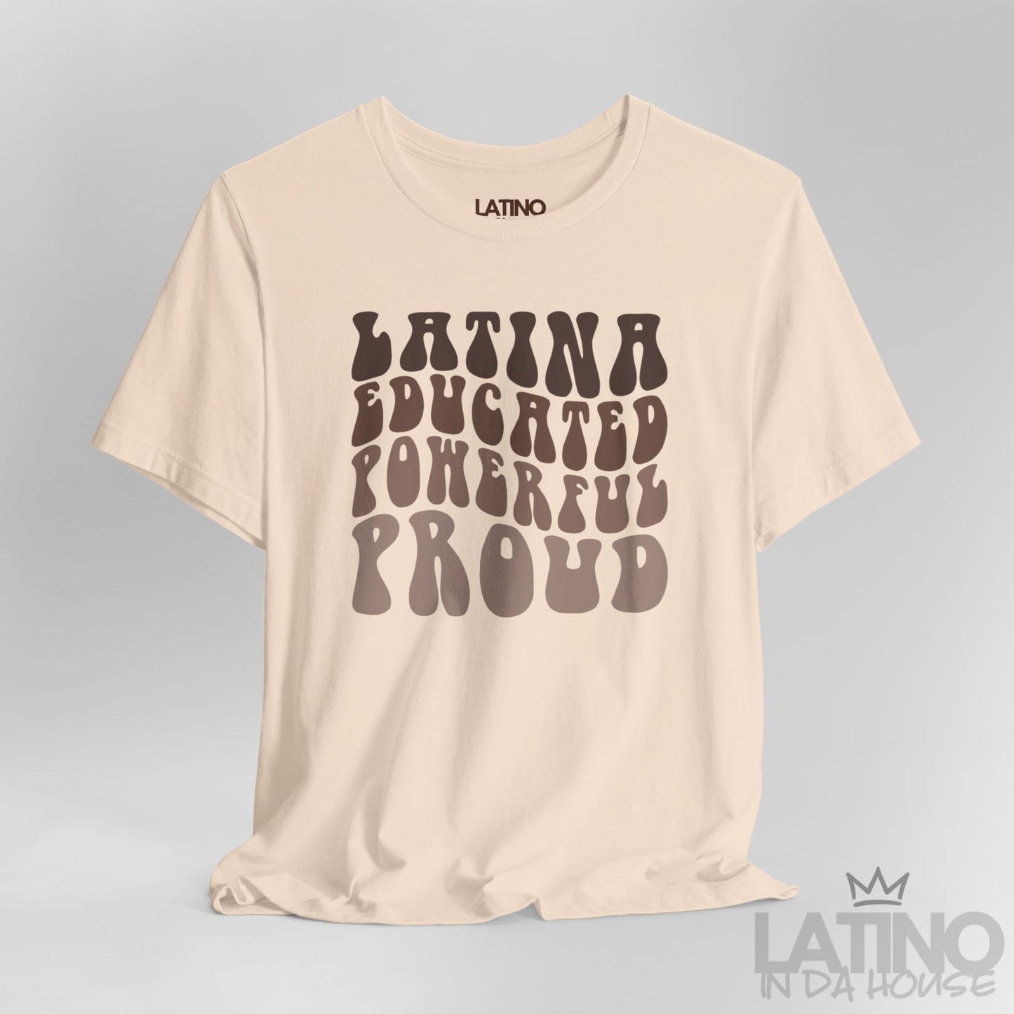 Close-up of retro bubble lettering ‘Latina Educated Powerful Proud’ on soft cream tee. Latino In Da House 