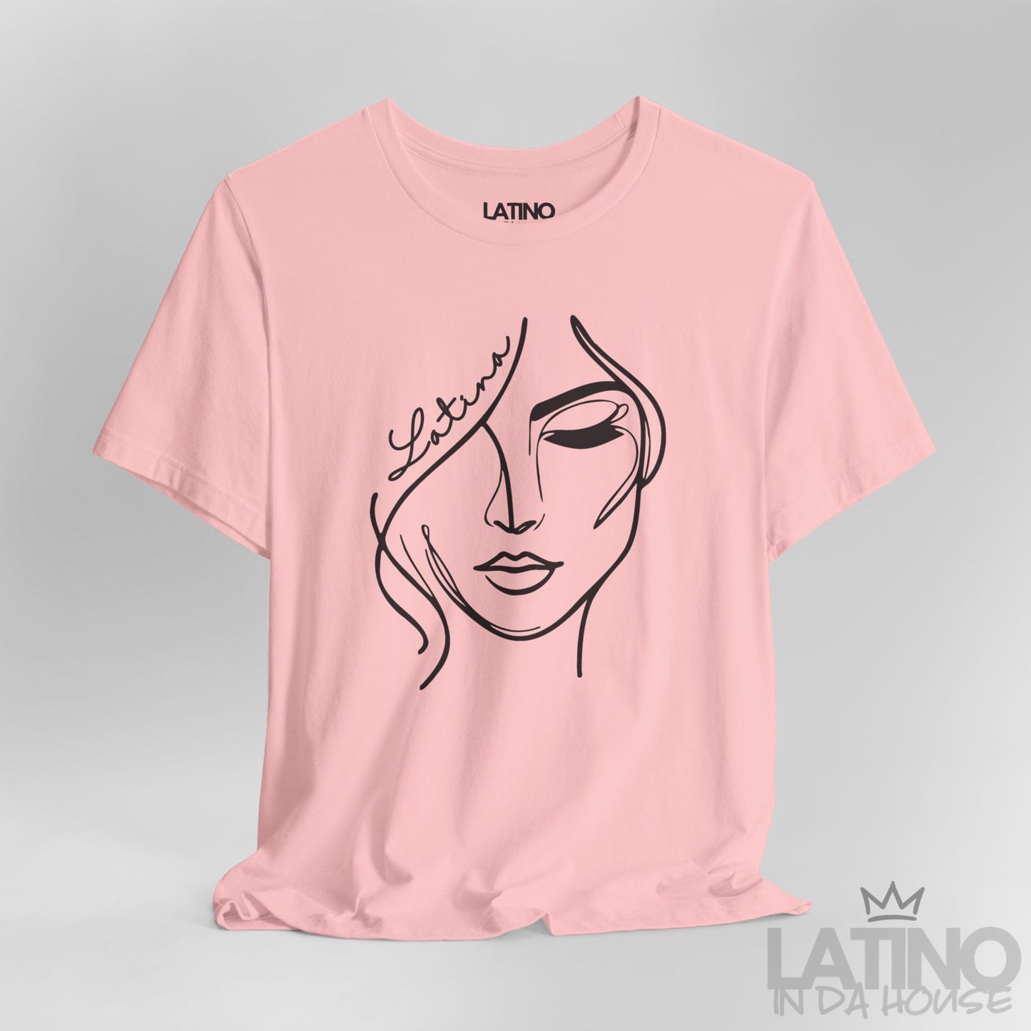 Close-up of “Latina” one-line face artwork on pink tee. Latino In Da House 
