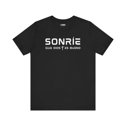 Sonríe Que Dios Es Bueno T-shirt in black with minimalist white lettering and subtle cross detail. Latino In Da House
