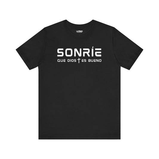 Sonríe Que Dios Es Bueno T-shirt in black with minimalist white lettering and subtle cross detail. Latino In Da House
