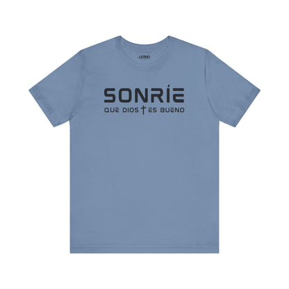 Sonríe Que Dios Es Bueno T-shirt in steel blue with modern black lettering and cross divider. Latino In Da House