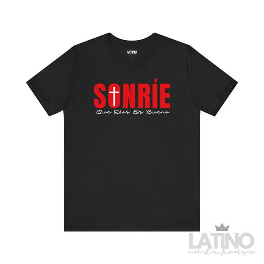 Sonríe Que Dios Es Bueno Christian T-Shirt with cross design, available in black.