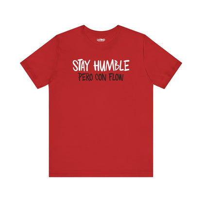 Red Stay Humble Pero Con Flow T-shirt with white text, minimalist Latino streetwear design promoting humble and flow. Latino In Da House