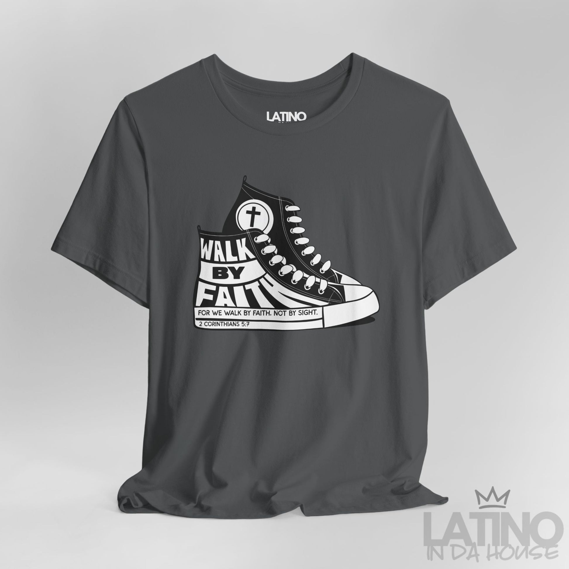 Close-up of Walk By Faith Asphalt T-shirt showing sneaker details and 2 Corinthians 5:7 text on sole. Latino In Da House