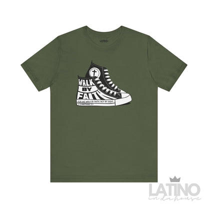 Military green T-shirt featuring a black and white Converse-style sneaker graphic with the phrase “Walk By Faith” and Bible verse 2 Corinthians 5:7.